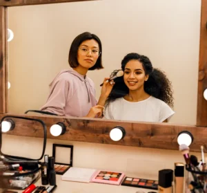 Two People Looking in the Dressing Room Mirror